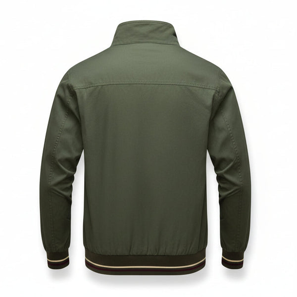 An olive green men's jacket shown from the back, laid flat on a textured gray carpet. The jacket features a high collar, long sleeves, and ribbed cuffs with thin stripes of white, red, and dark green.
