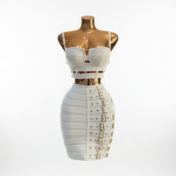A white strappy mini dress displayed on a metallic gold form mannequin against a white studio background.