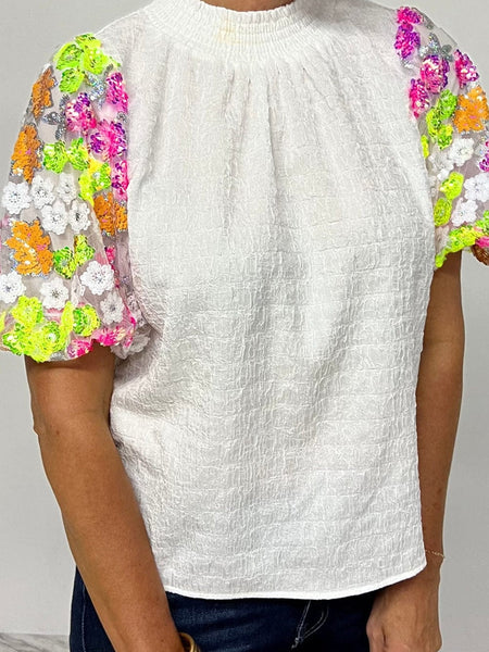 Women's Short Sleeve Sequin Embellished Top made for easy styling and wardrobe coordination, with premium-like structure and finish.
