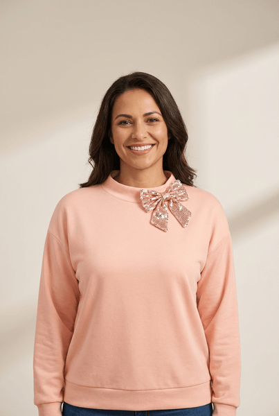 Women's Sequin Bow Mock Neck Sweatshirt in Apricot Pink