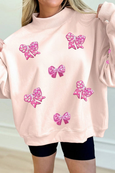 Women's Sequin Bow Mock Neck Sweatshirt in Apricot Pink
